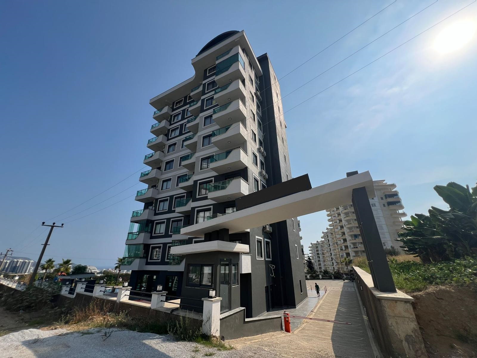 A 1+1 apartment at a great price in Mahmutlar – furnished and with mountain views