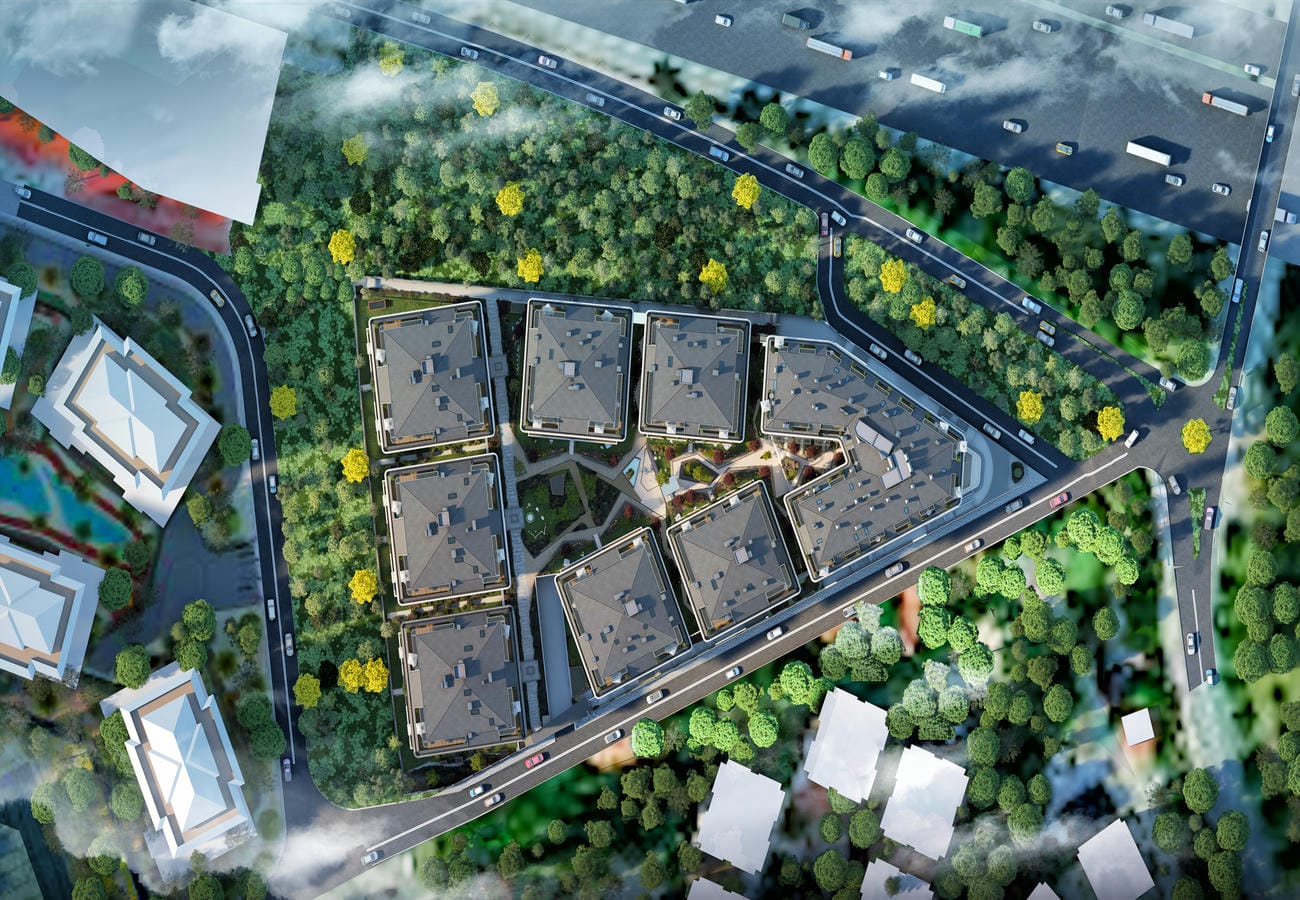 Sekiz koyu çatılı blok ve çevresindeki ormanın havadan görünümü, İstanbul’daki konut sitesinde