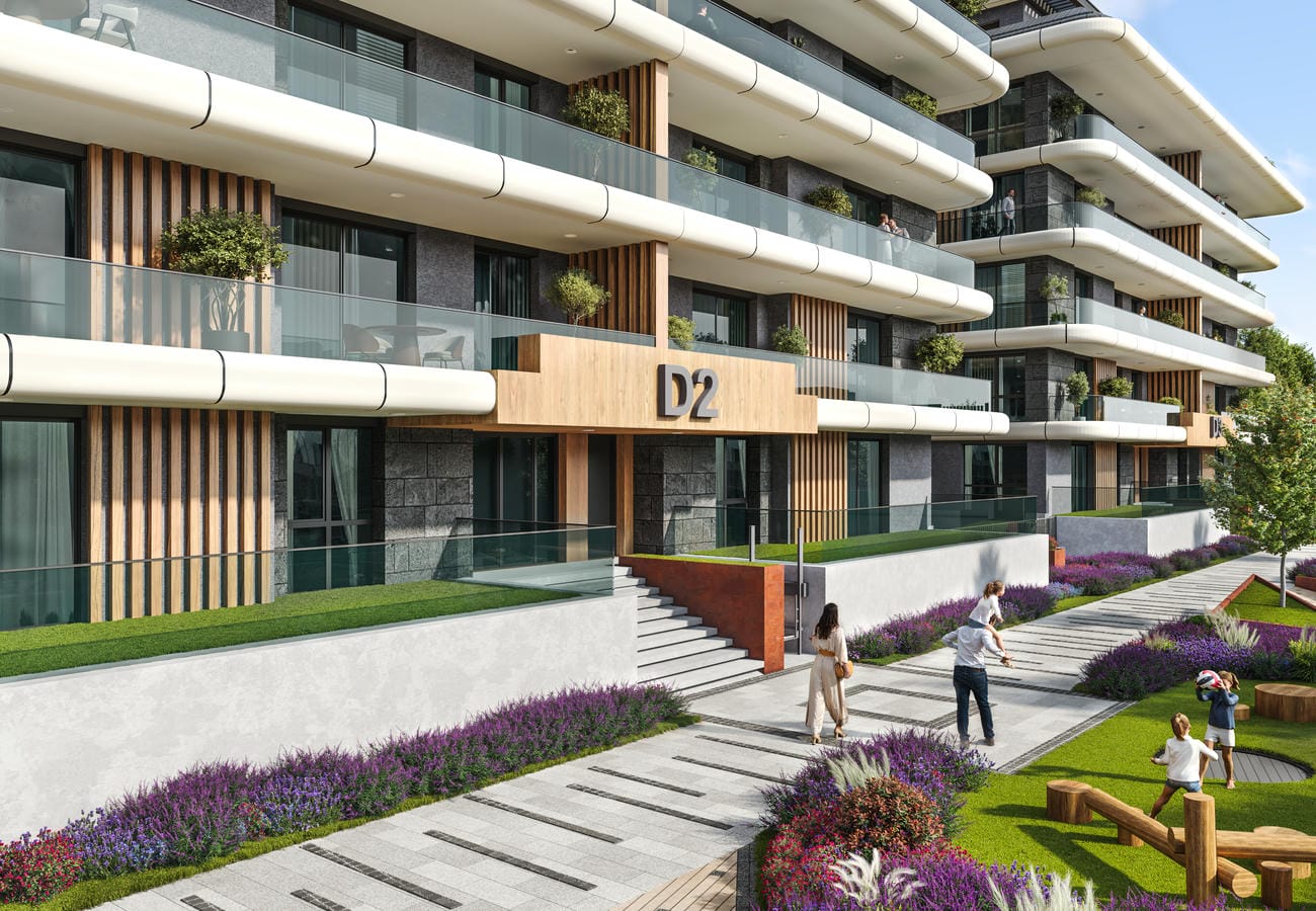 Apartmanların bulunduğu sitede geniş giriş merdiveni, mor çiçeklikler ve ahşap oyun yapısı