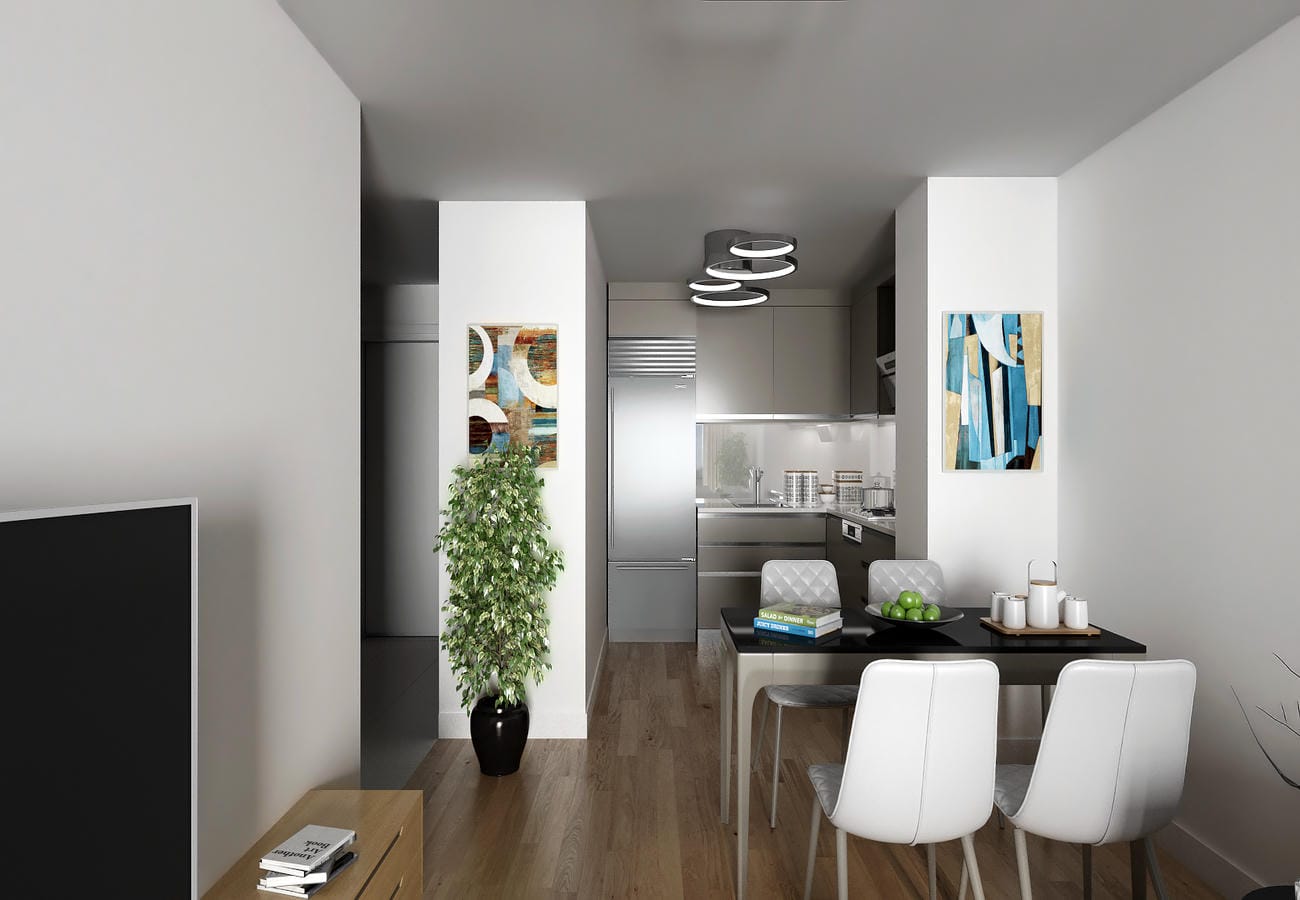 Dairenin mutfak-yemek alanında siyah masa, dört beyaz sandalye ve gri ankastre mutfak