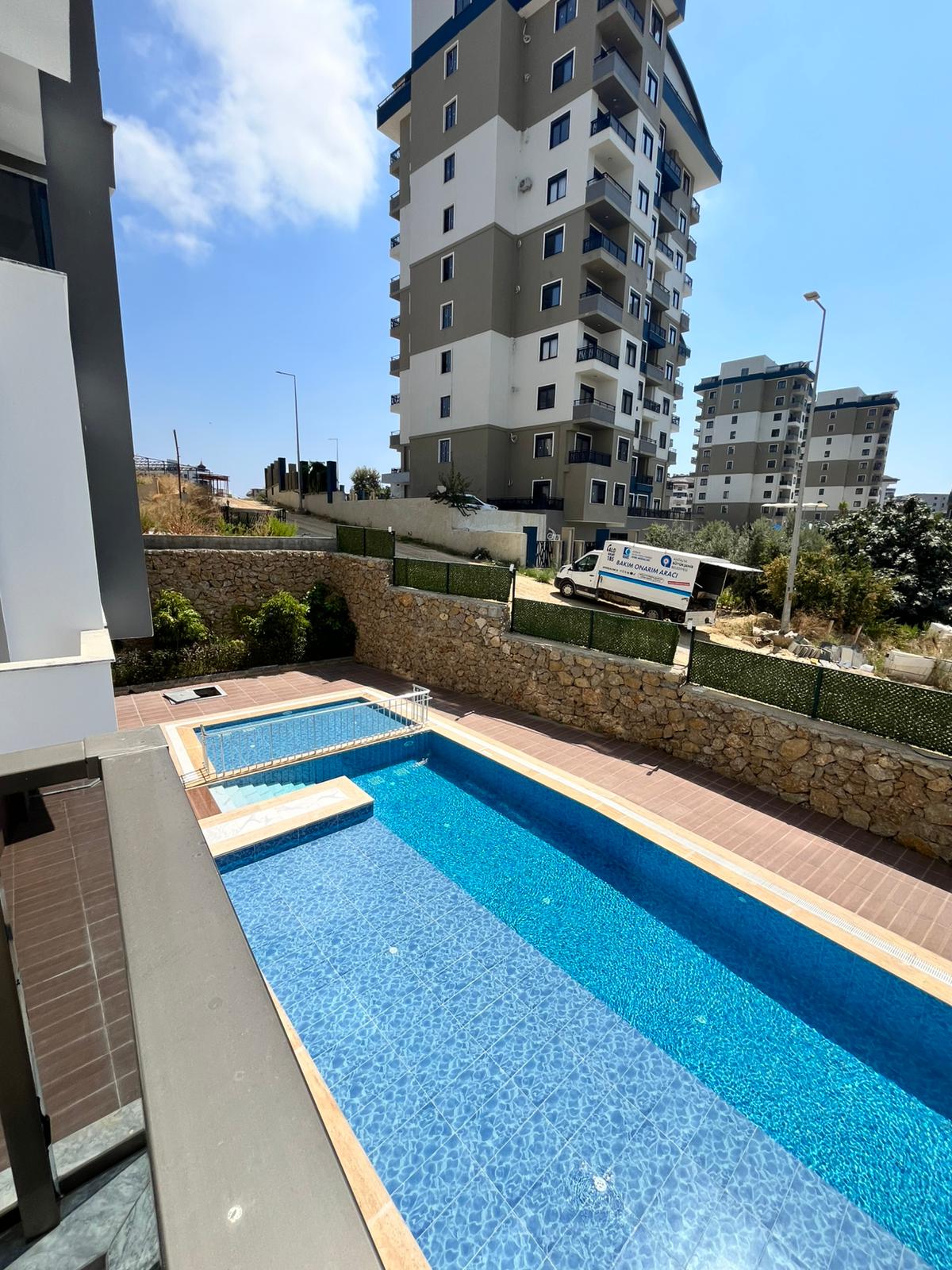 Avsallar 3. Bölge'de modern bir sitede yer alan 1+1 dairenin uzun süreli kiralanması.