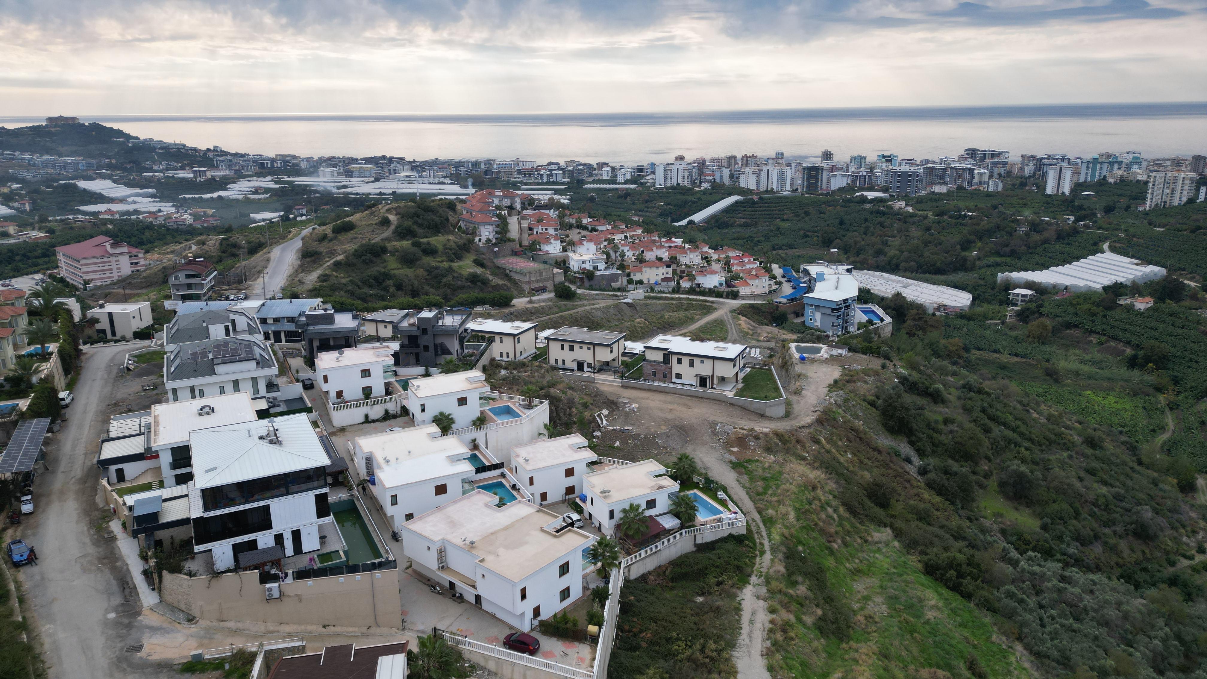 Panoramic aerial view of a residential area and sea on the horizon in Kargicak for sale