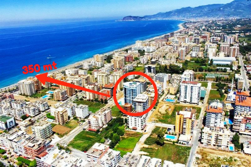 Квартира 2+1 140 м2 в Махмутларе – мебель, остеклённый балкон, премиальный комплекс