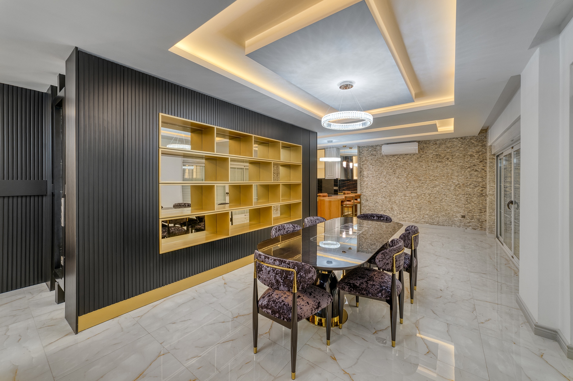 Villa dining area with a glass table, six chairs and panoramic sliding doors in Alanya for sale