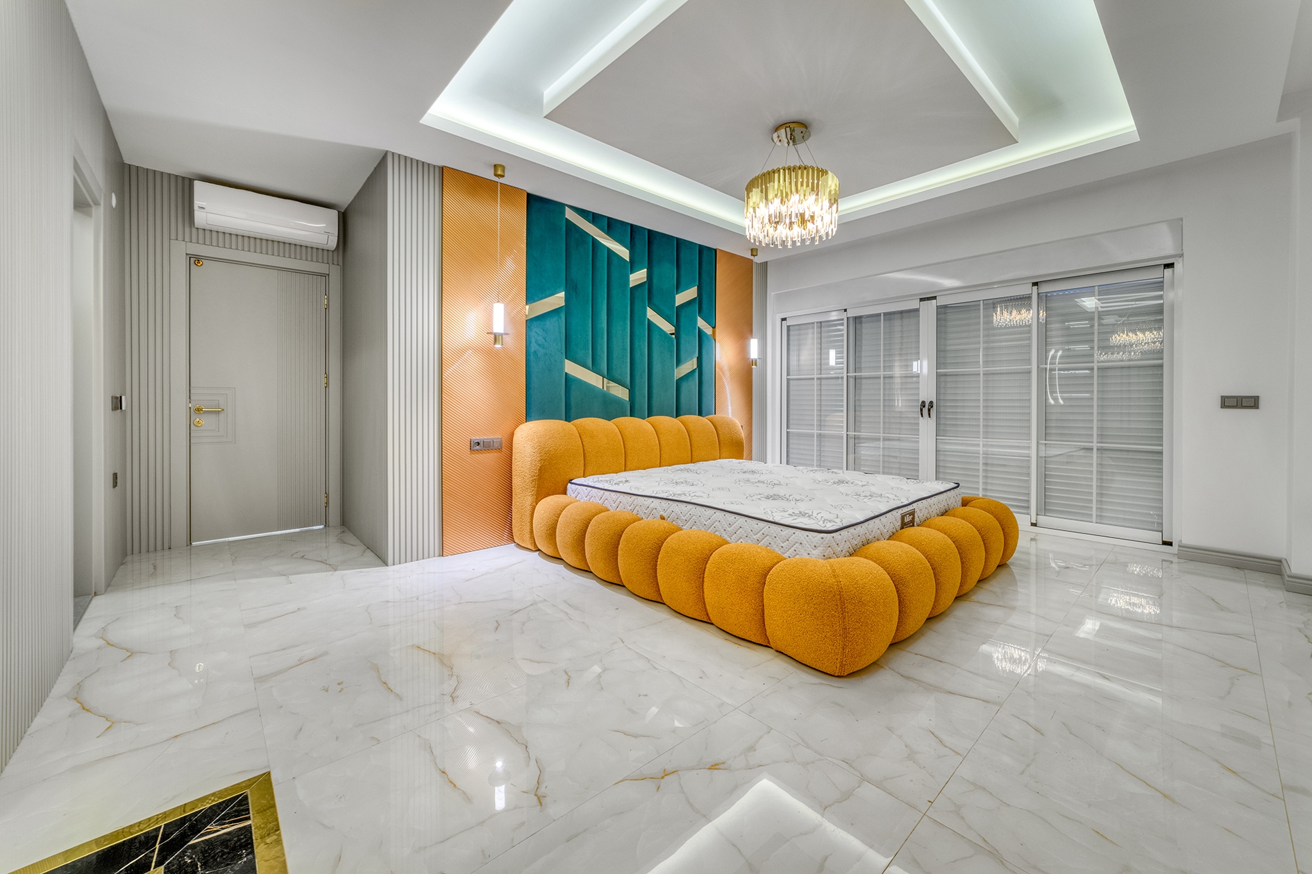 Villa bedroom with an orange bed, turquoise panel and closed roller blinds