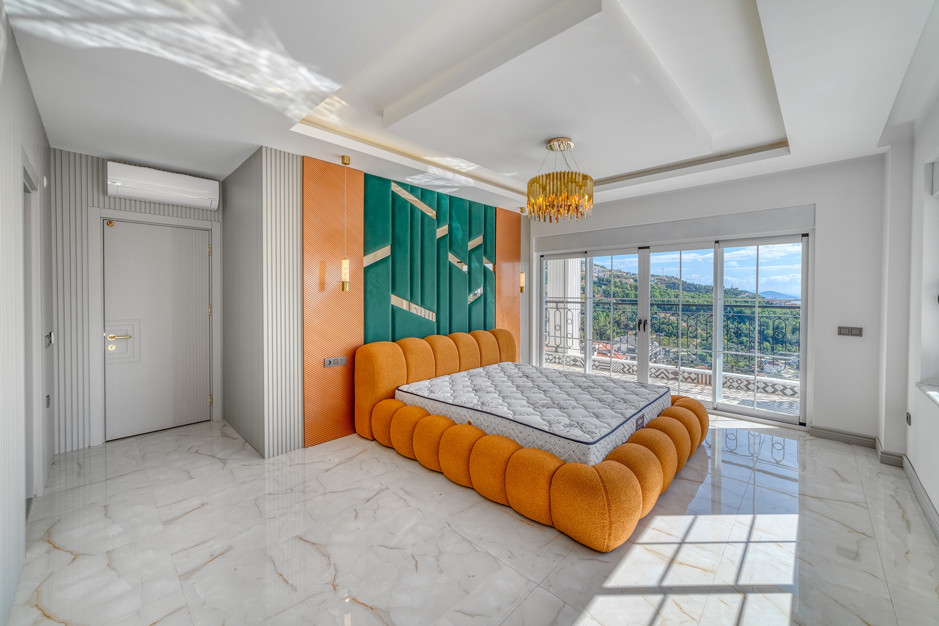 House bedroom with an orange bed, panoramic terrace doors and a turquoise panel