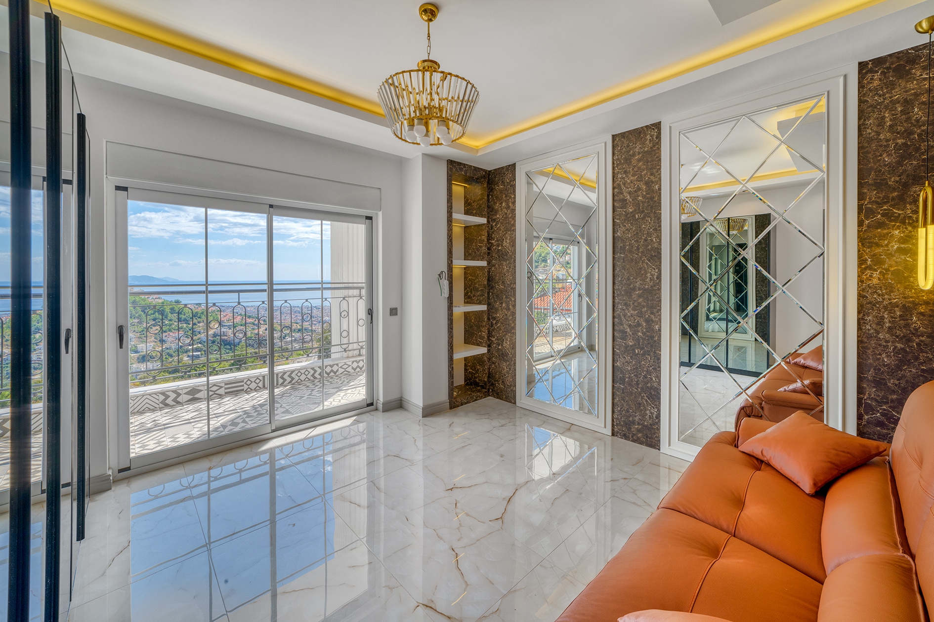 Orange corner sofa by panoramic glazing with a sea view in Alanya