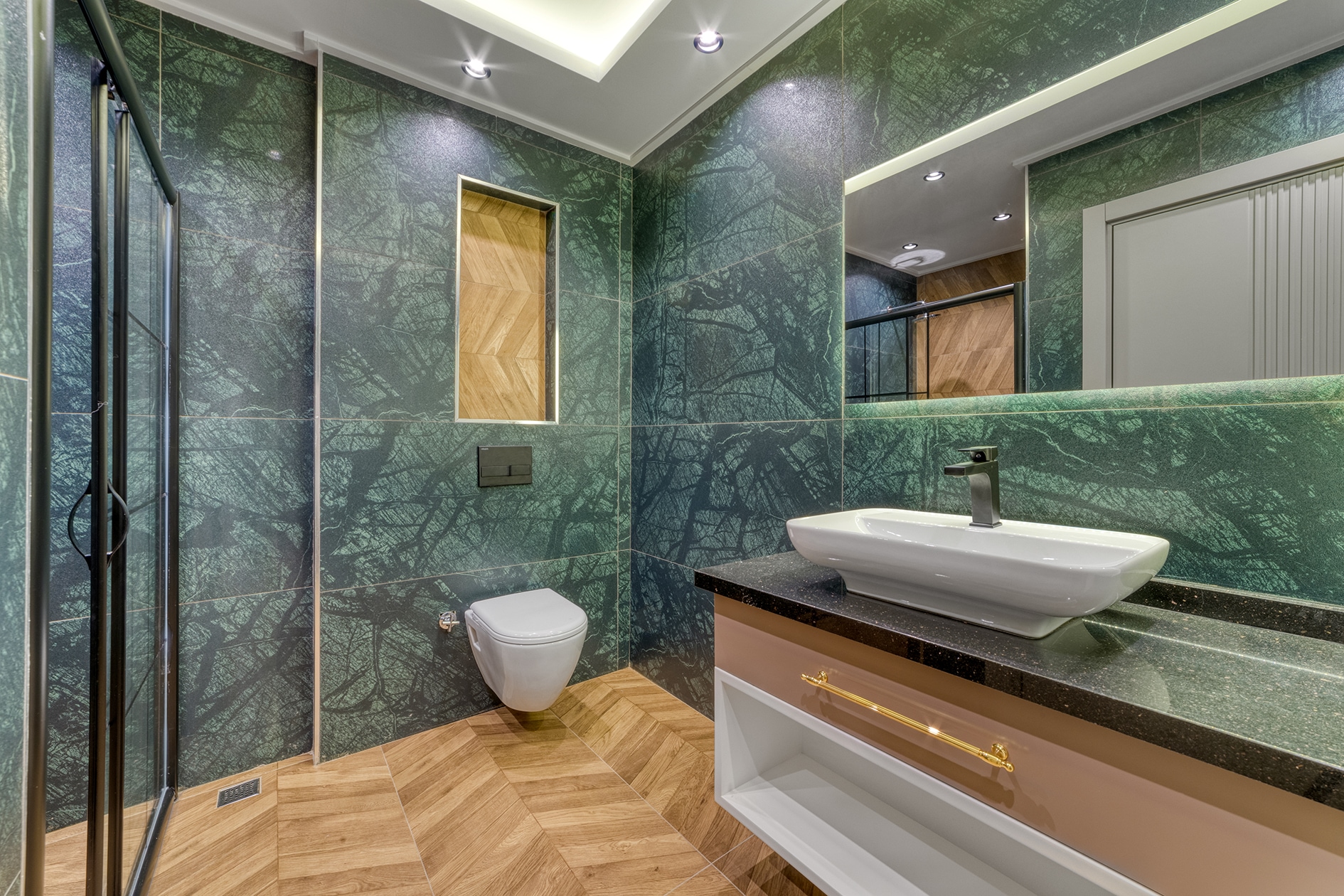 White countertop basin and wall-hung toilet in a villa bathroom