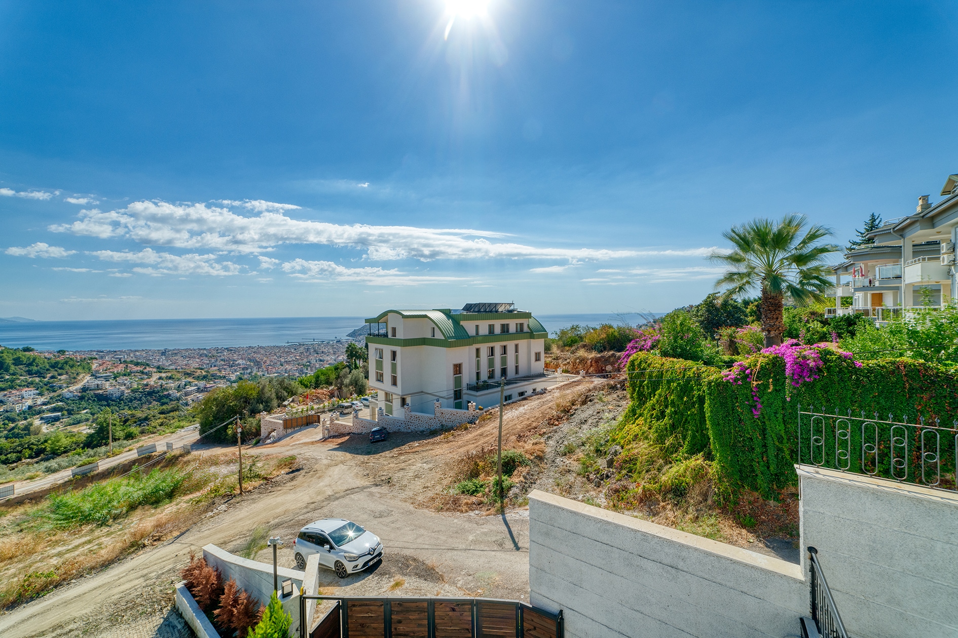 Panoramic sea view over Alanya with green slopes and city buildings in Turkey