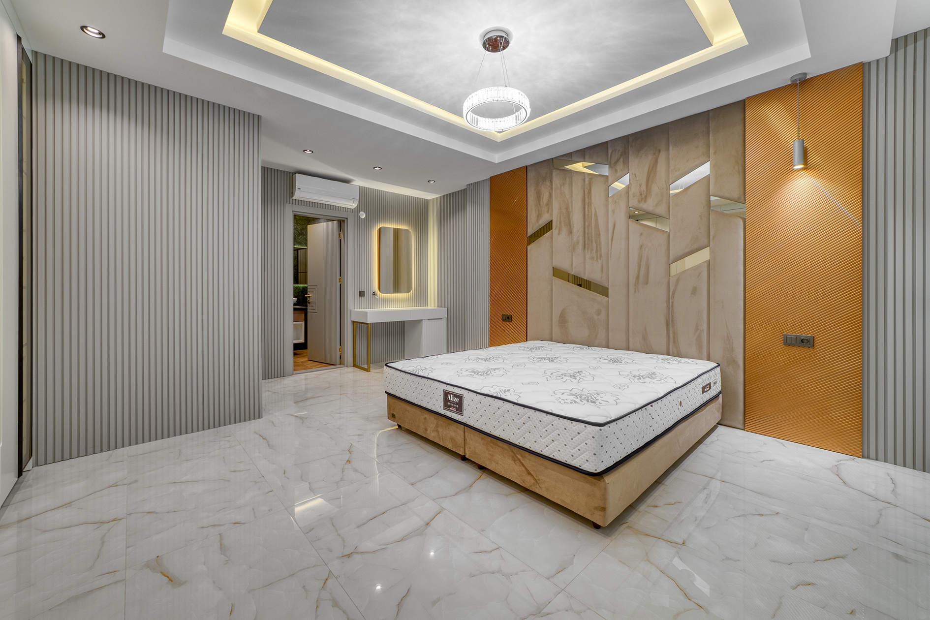 Double bed with vertical panels and a dressing table in a house bedroom in Alanya