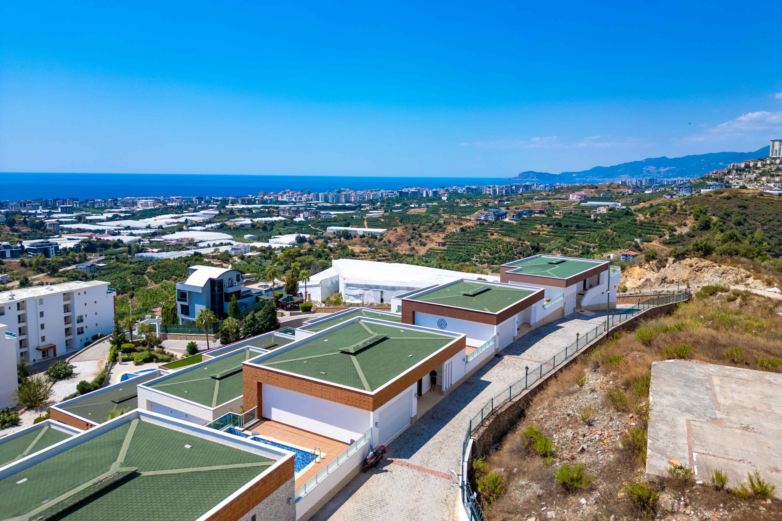 Green-roof villas with private pools and white facades in Turkey available for sale