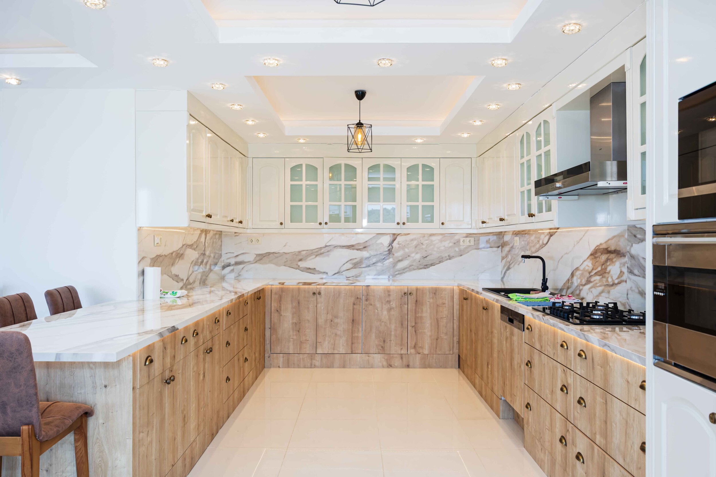 Corner kitchen with marble worktop and gas hob in a villa in Kargicak