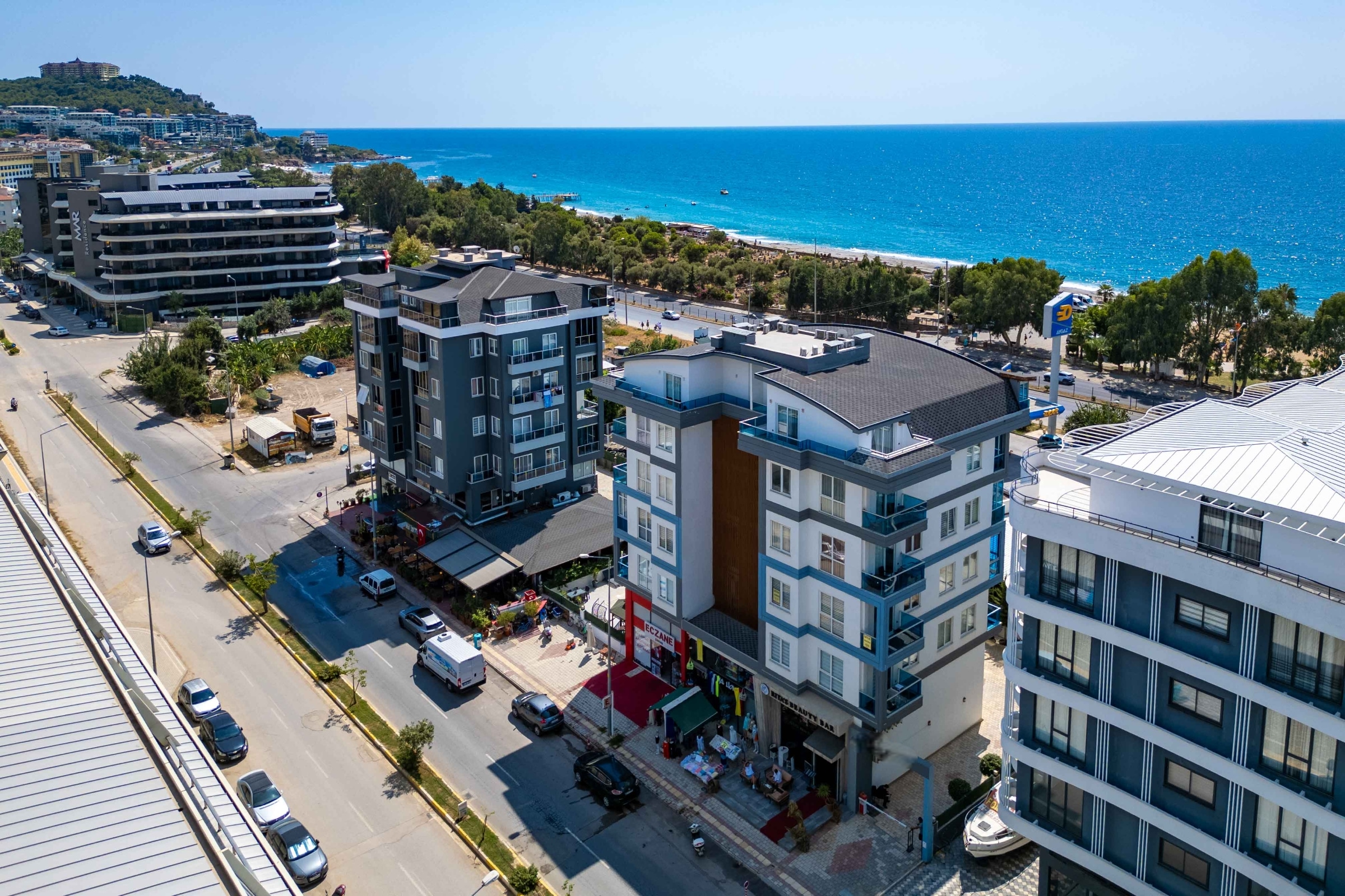 White residential building beside the sea in Kargicak where homes are for sale
