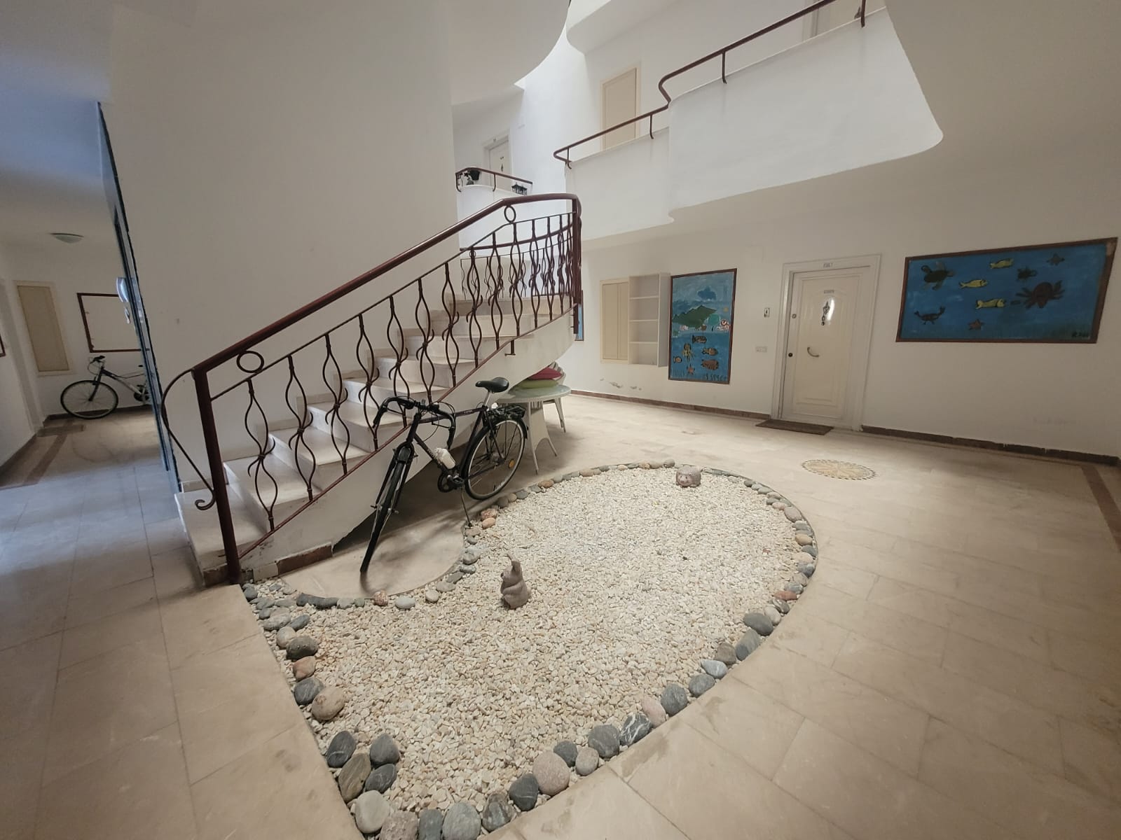 Wrought-iron staircase with bicycles in an apartment complex in Tosmur