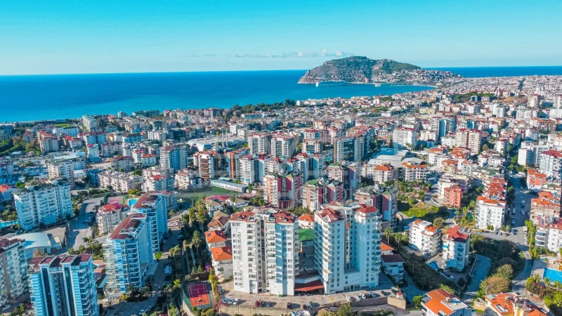 Panoramic bay and city view from above show a 2+1 apartment for sale in Cikcilli, Alanya, Turkey — New Level Group
