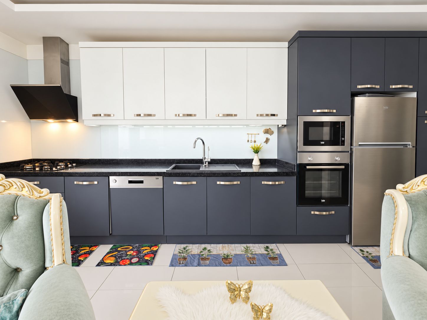 Kitchen with white and dark gray cabinetry, black stone worktop and appliances in a 2+1 apartment in Kargicak