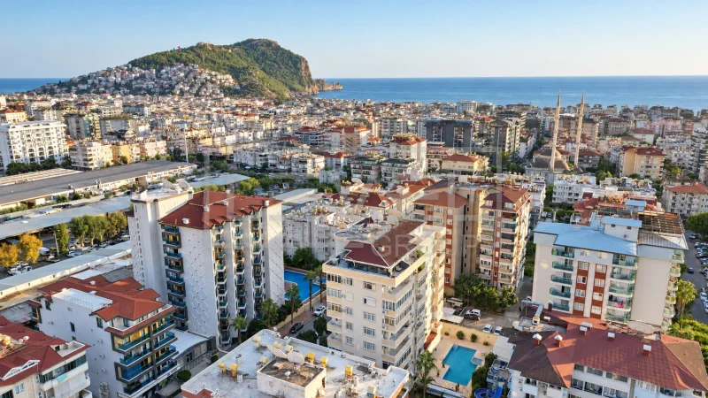 Панорама города, моря и скалистого мыса: квартира 2+1 в продаже в Алании, Турция — New Level Group