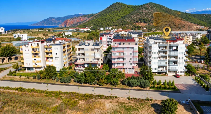 Вид с воздуха на жилые дома у моря: квартира 2+1 в продаже в Газипаше, Алании, Турция — New Level Group
