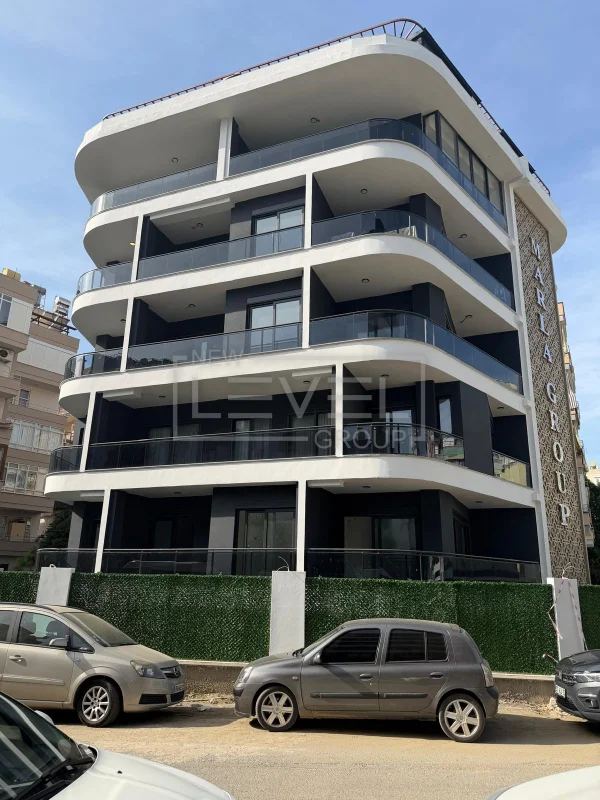 Modern facade with curved balconies: a 2+1 apartment for sale in Alanya, Turkey — New Level Group