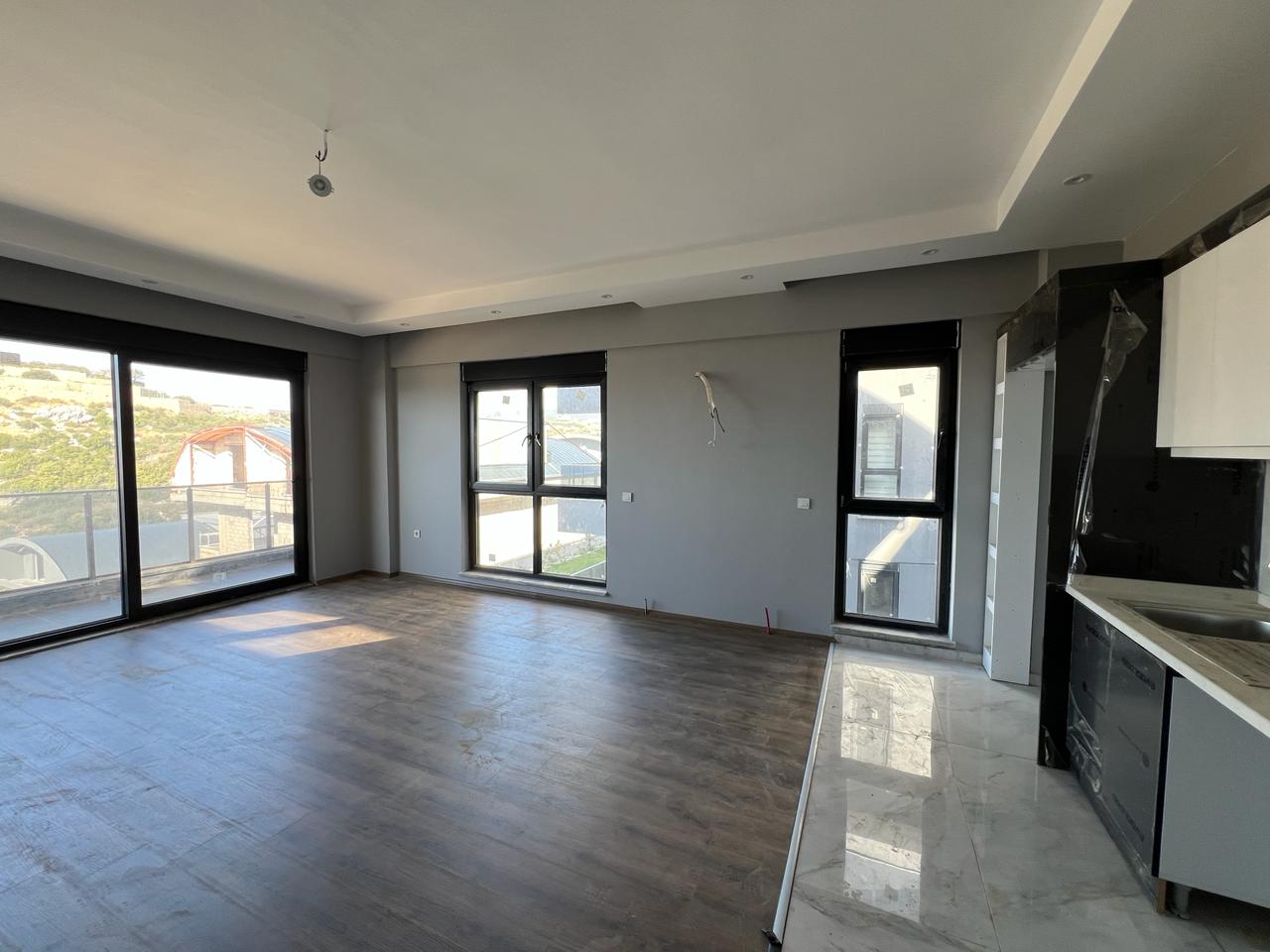 Alanya Konaklı'da deniz manzaralı, modern bir komplekste, şık tasarımlı, yeni 2+1 daire.