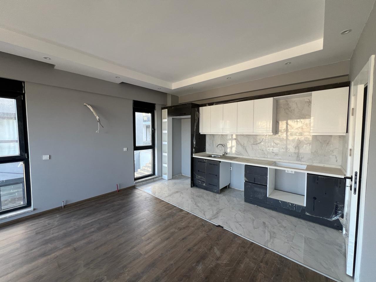 Alanya Konaklı'da deniz manzaralı, modern bir komplekste, şık tasarımlı, yeni 2+1 daire.