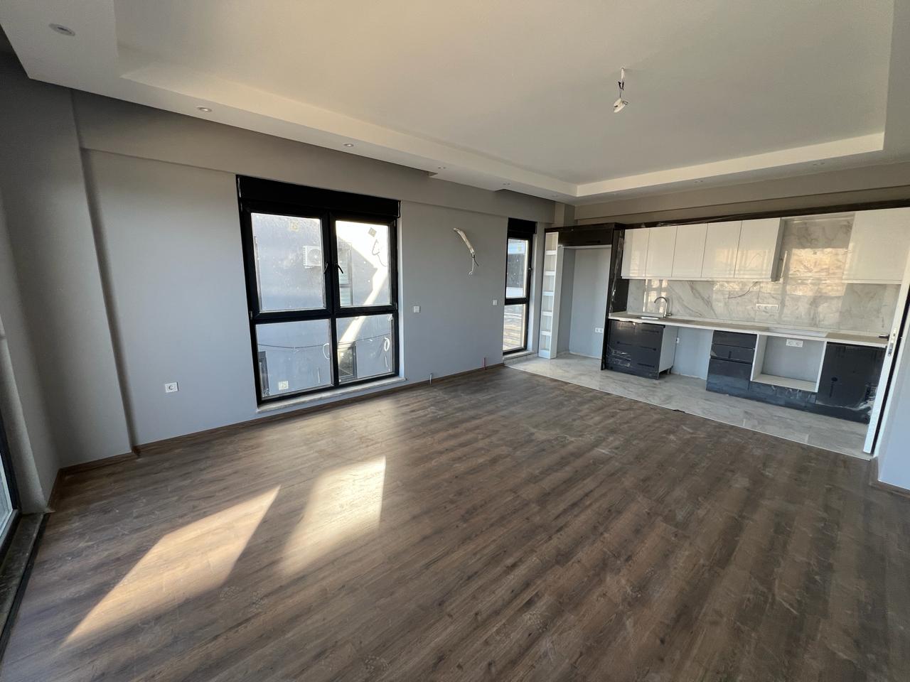 Alanya Konaklı'da deniz manzaralı, modern bir komplekste, şık tasarımlı, yeni 2+1 daire.