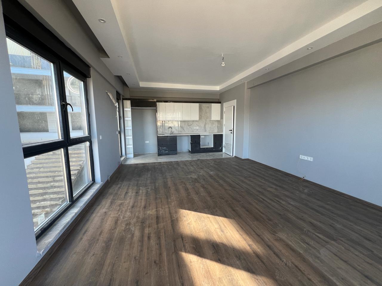 Alanya Konaklı'da deniz manzaralı, modern bir komplekste, şık tasarımlı, yeni 2+1 daire.