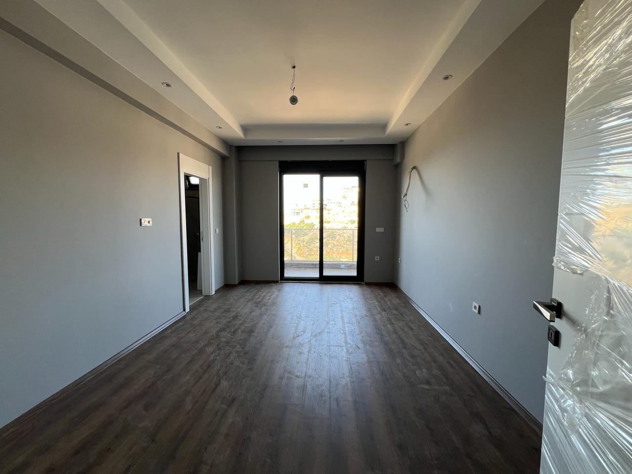 Alanya Konaklı'da deniz manzaralı, modern bir komplekste, şık tasarımlı, yeni 2+1 daire.