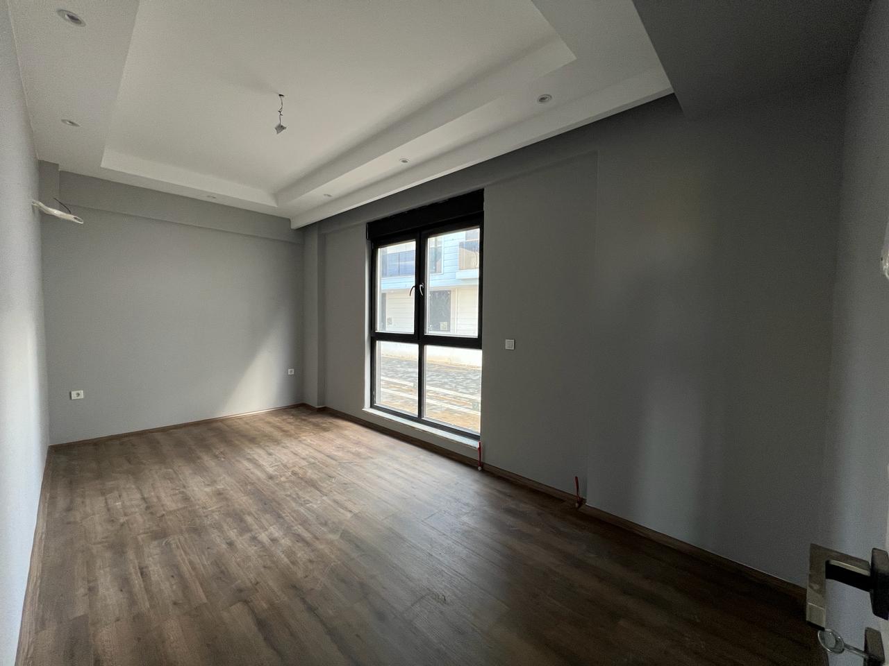 Alanya Konaklı'da deniz manzaralı, modern bir komplekste, şık tasarımlı, yeni 2+1 daire.