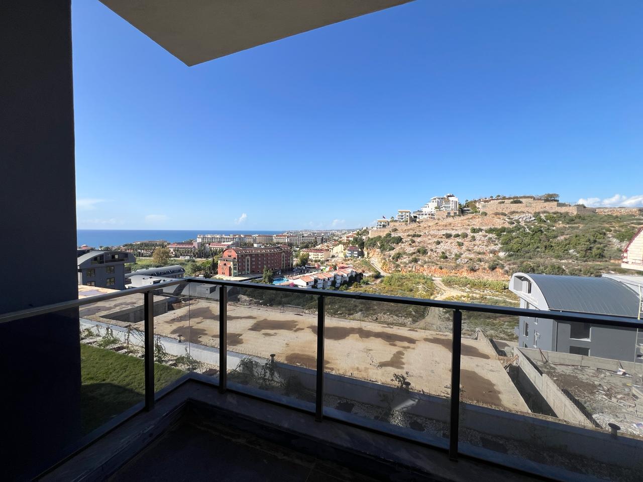 Alanya Konaklı'da deniz manzaralı, modern bir komplekste, şık tasarımlı, yeni 2+1 daire.