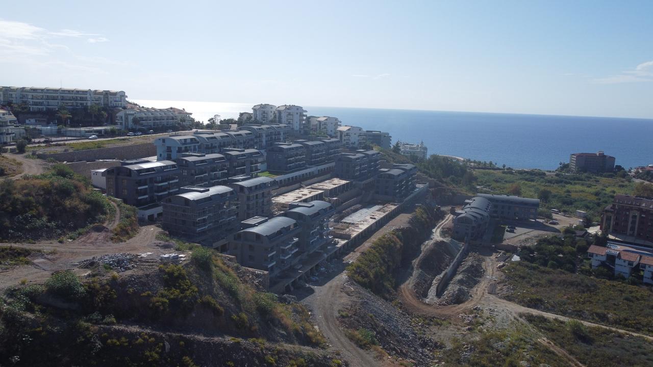 Alanya Konaklı'da deniz manzaralı, modern bir komplekste, şık tasarımlı, yeni 2+1 daire.