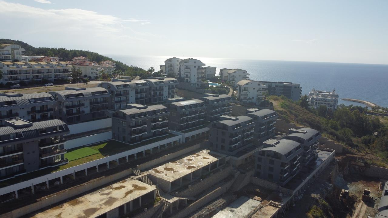 Alanya Konaklı'da deniz manzaralı, modern bir komplekste, şık tasarımlı, yeni 2+1 daire.
