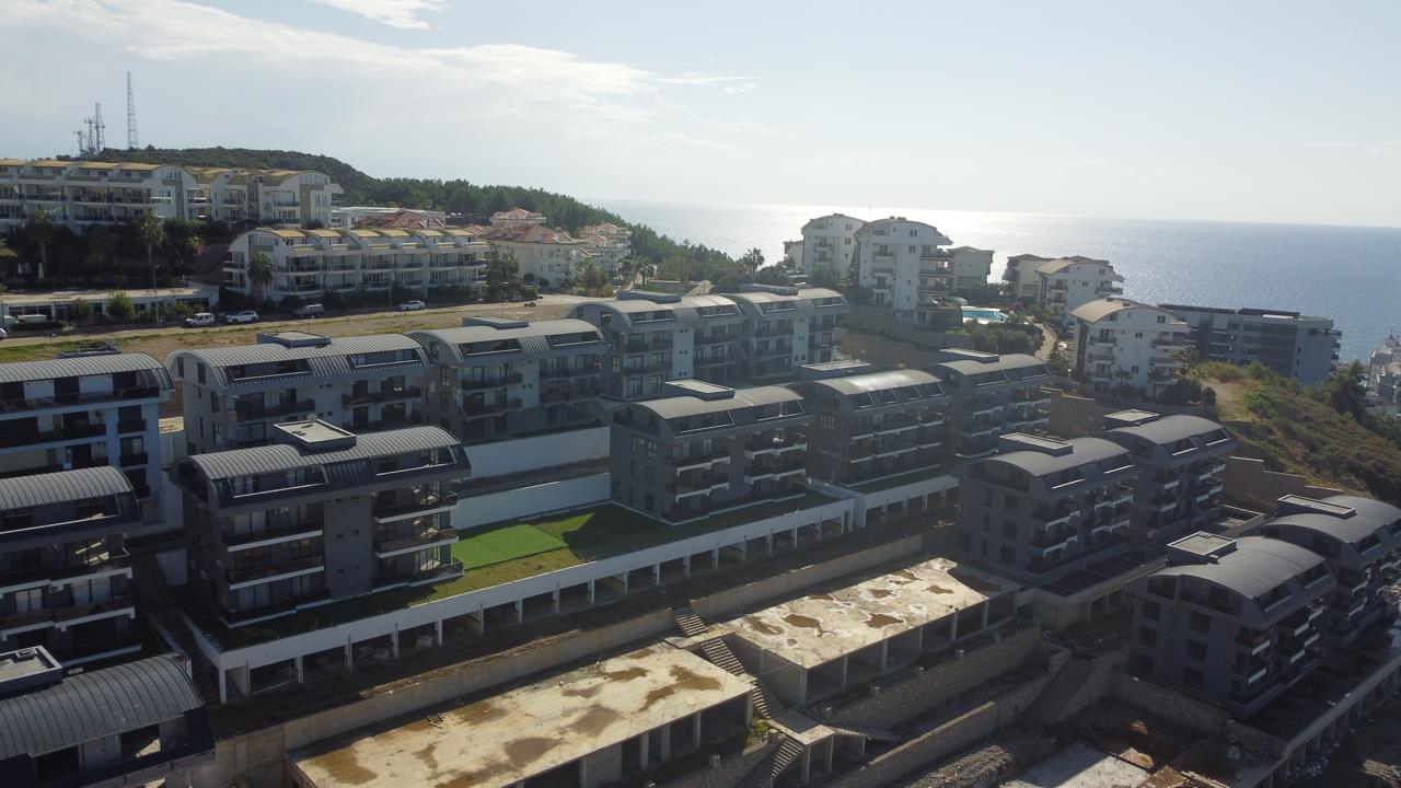 Alanya Konaklı'da deniz manzaralı, modern bir komplekste, şık tasarımlı, yeni 2+1 daire.