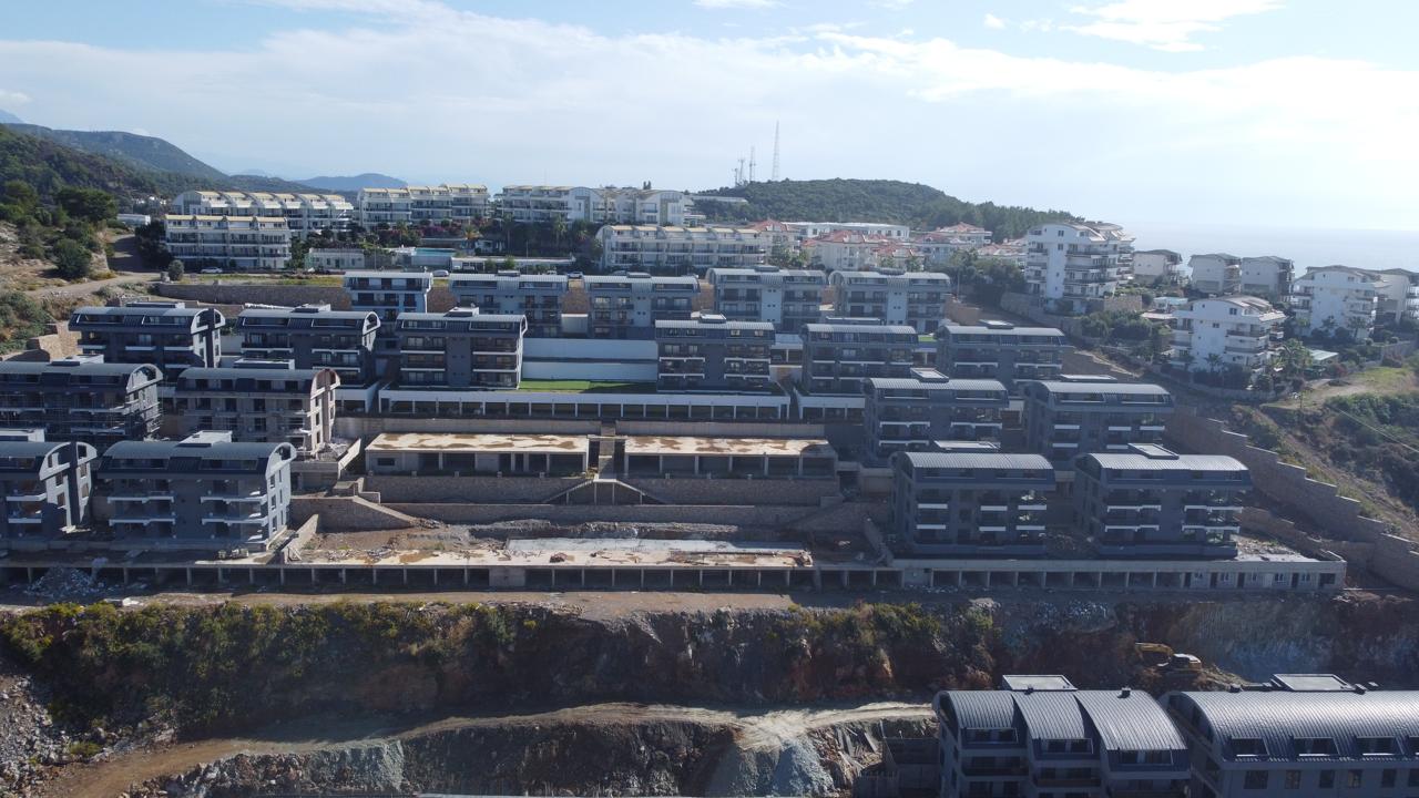 Alanya Konaklı'da deniz manzaralı, modern bir komplekste, şık tasarımlı, yeni 2+1 daire.