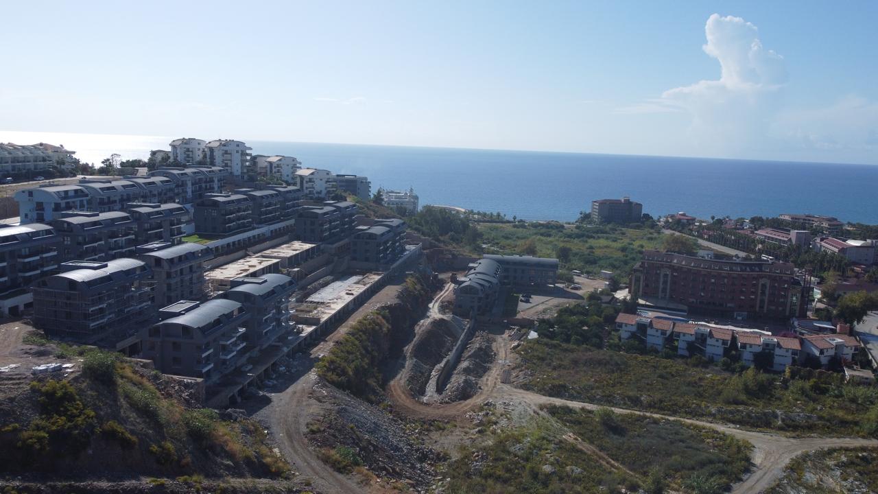 Alanya Konaklı'da deniz manzaralı, modern bir komplekste, şık tasarımlı, yeni 2+1 daire.