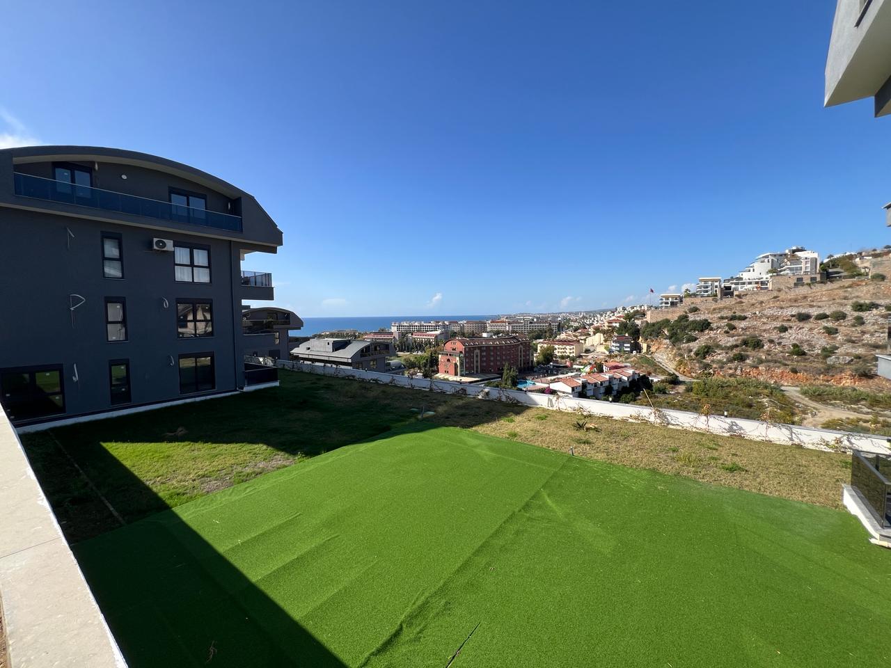 Alanya Konaklı'da deniz manzaralı, modern bir komplekste, şık tasarımlı, yeni 2+1 daire.
