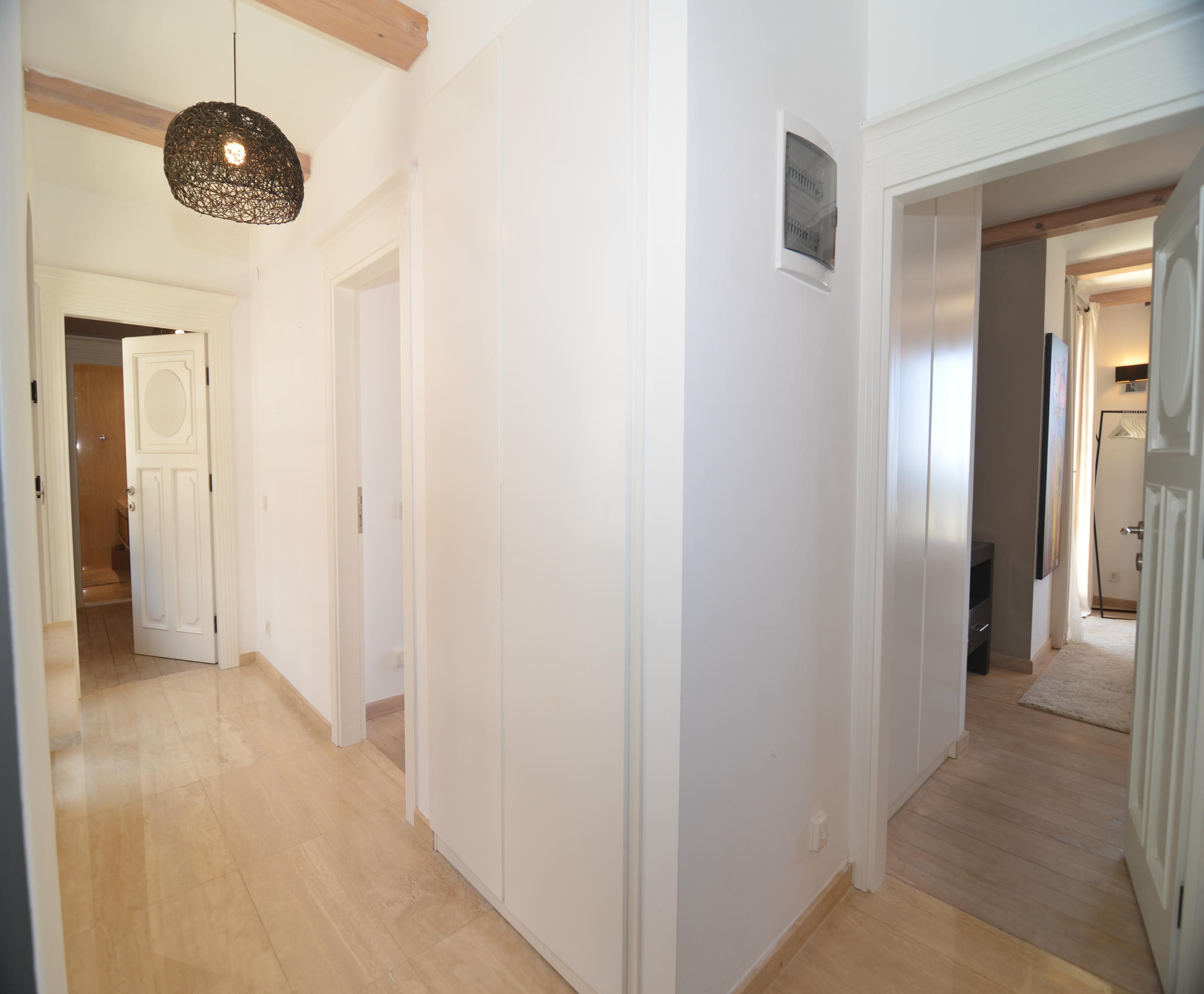 Bright hall with white doors, built-in wardrobe and timber beams in Alanya
