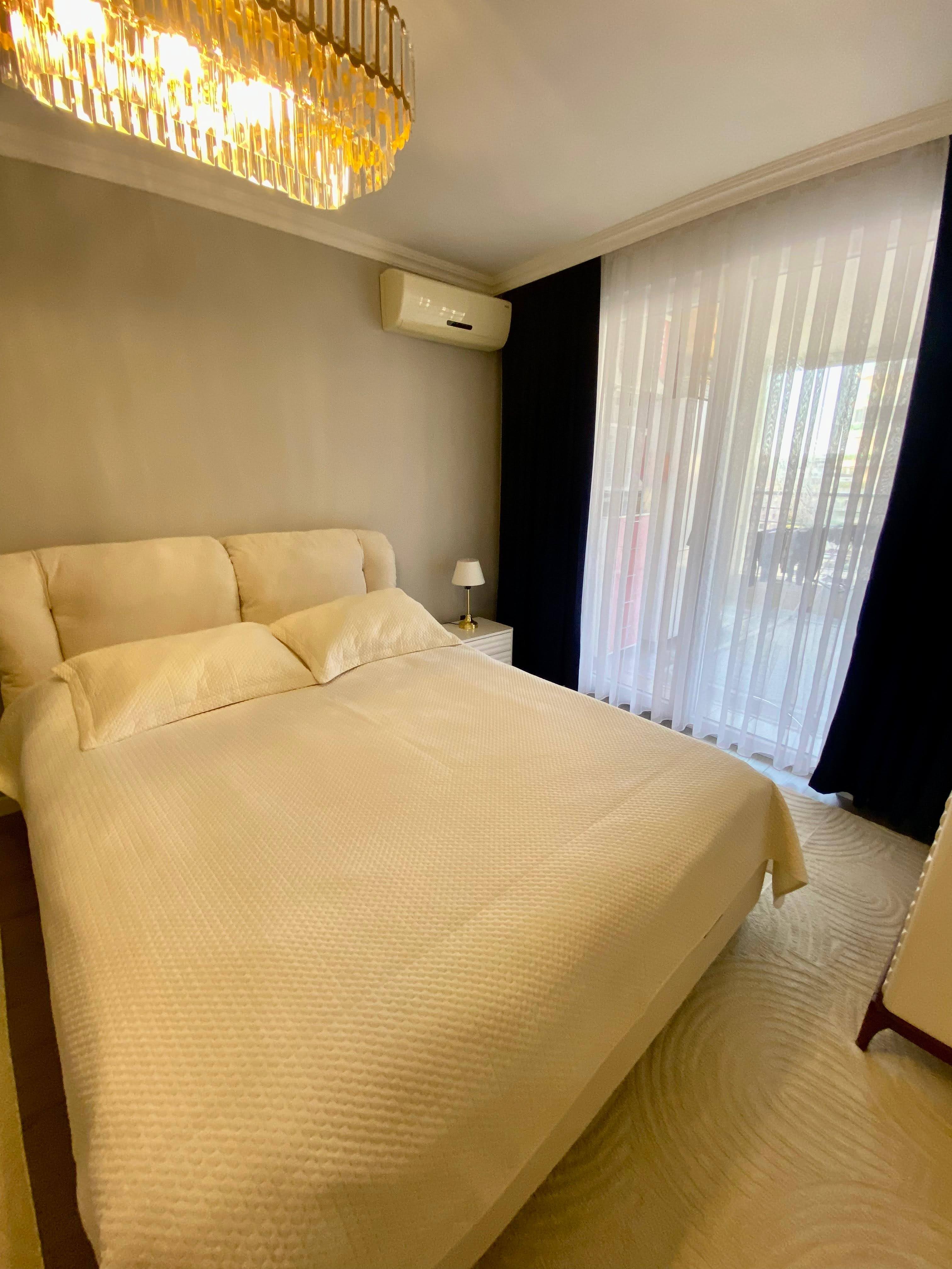 2+1 apartment with sea view in the center of Mahmutlar – furnished, separate kitchen and glazed balcony