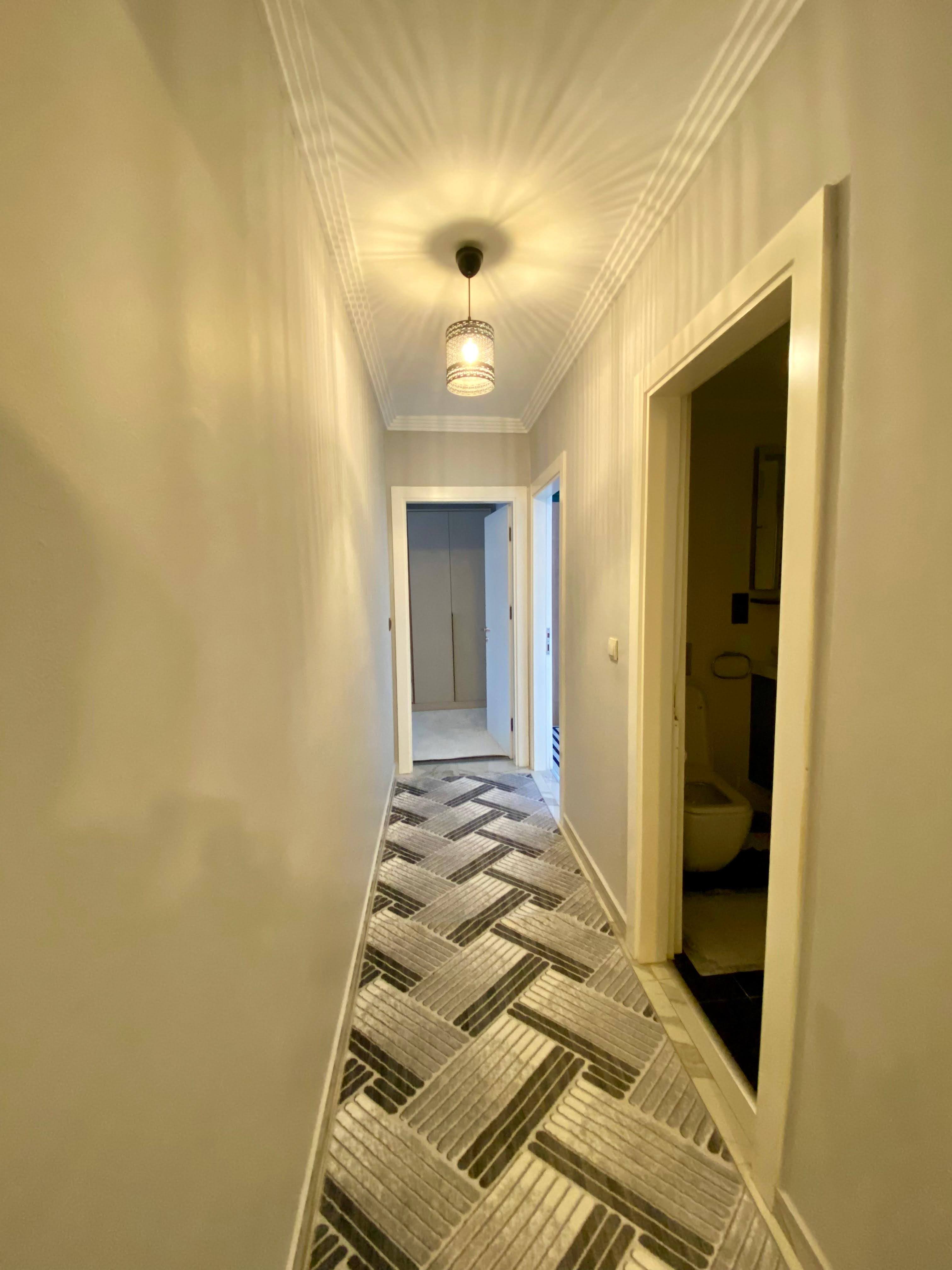 2+1 apartment with sea view in the center of Mahmutlar – furnished, separate kitchen and glazed balcony