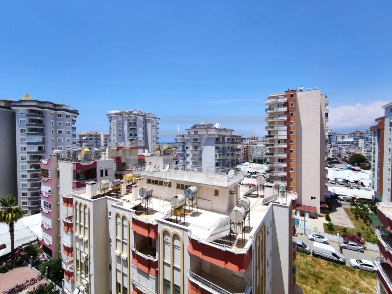 City panorama and thin sea horizon: 2+1 apartment for sale in Mahmutlar, Alanya, Turkey — New Level Group