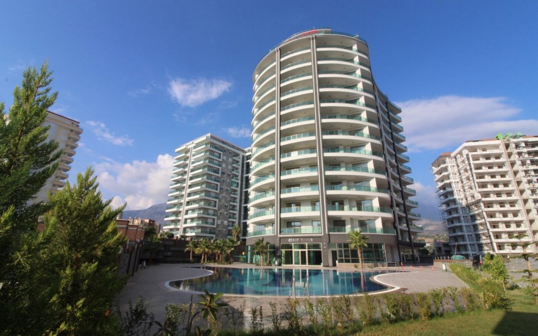 Yuvarlak cepheli konut ve havuzlu site Mahmutlar’da, Alanya’da satılık 1+1 daire Türkiye’de — New Level Group
