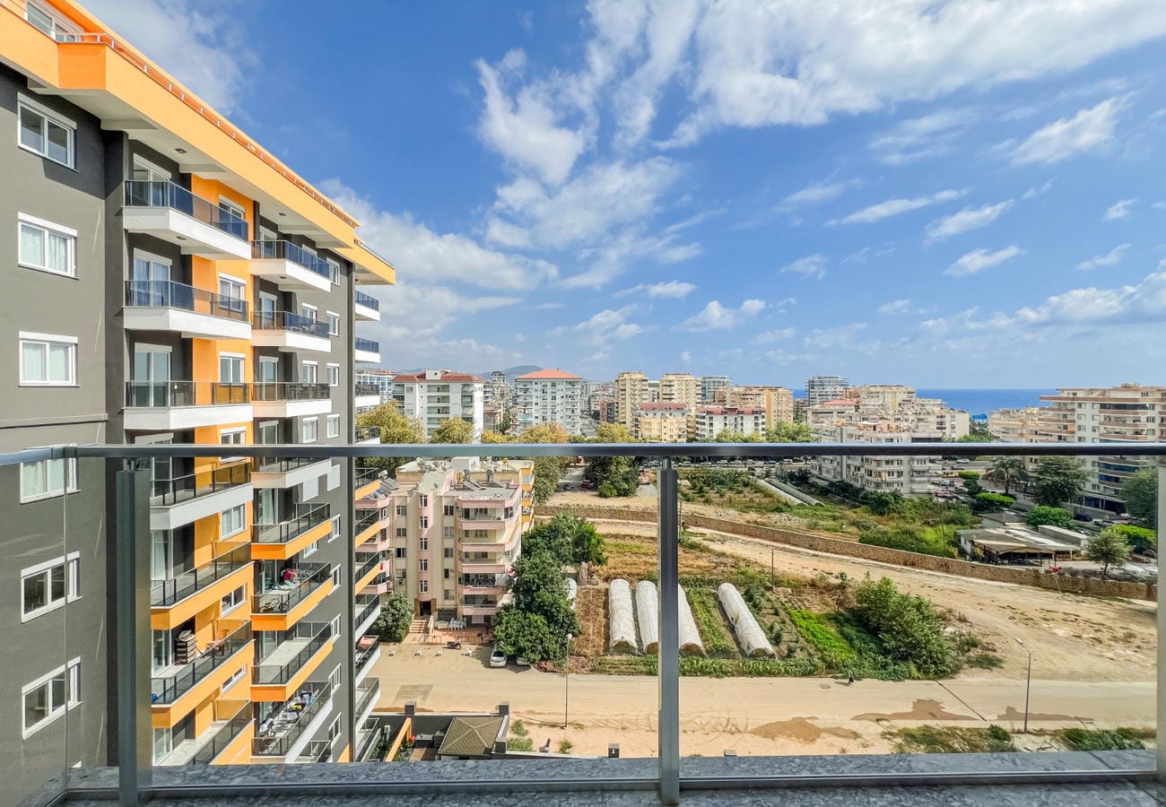 City view and a strip of sea from a balcony in a residential complex in Turkey