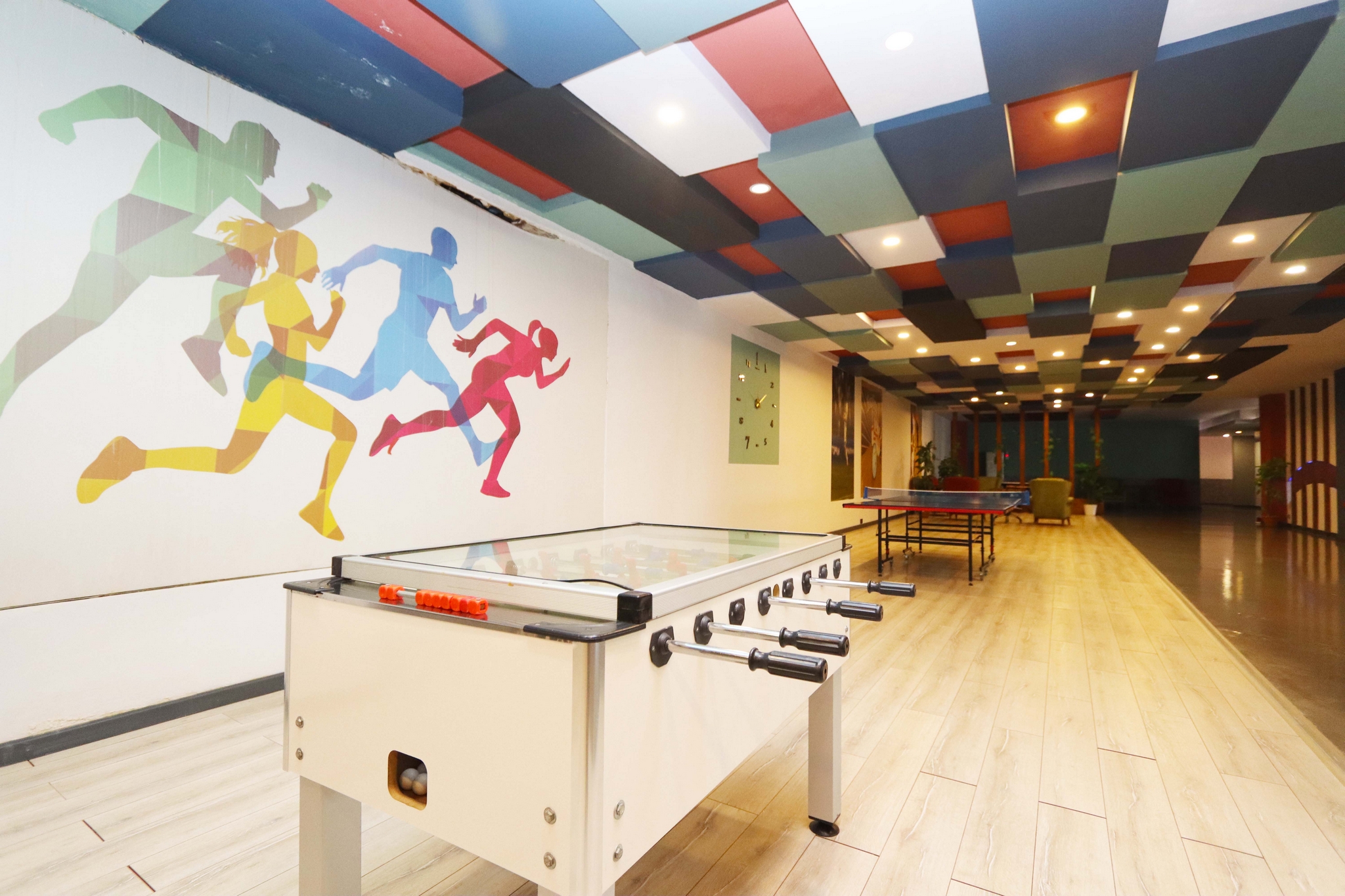 Games area with table football, table tennis and gym equipment for residents of apartments