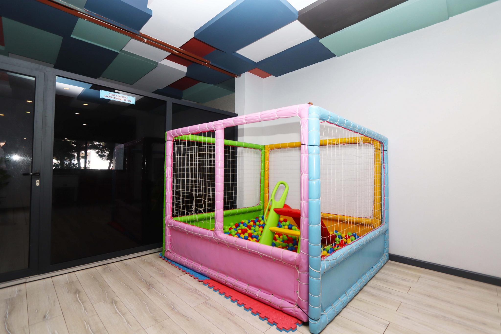 Children’s play area with a soft ball pit and protective elements for residents of apartments in Kargicak