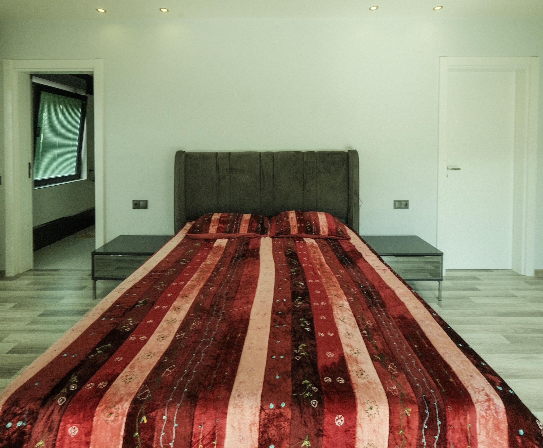 Bedroom with a double bed and a window with blinds in Kargicak