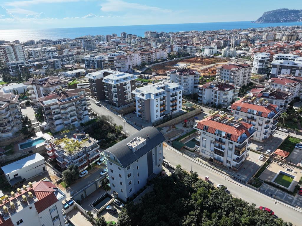 Panoramic city quarter and blue sea from a 2+1 penthouse for sale in Oba, Alanya, Turkey — New Level Group