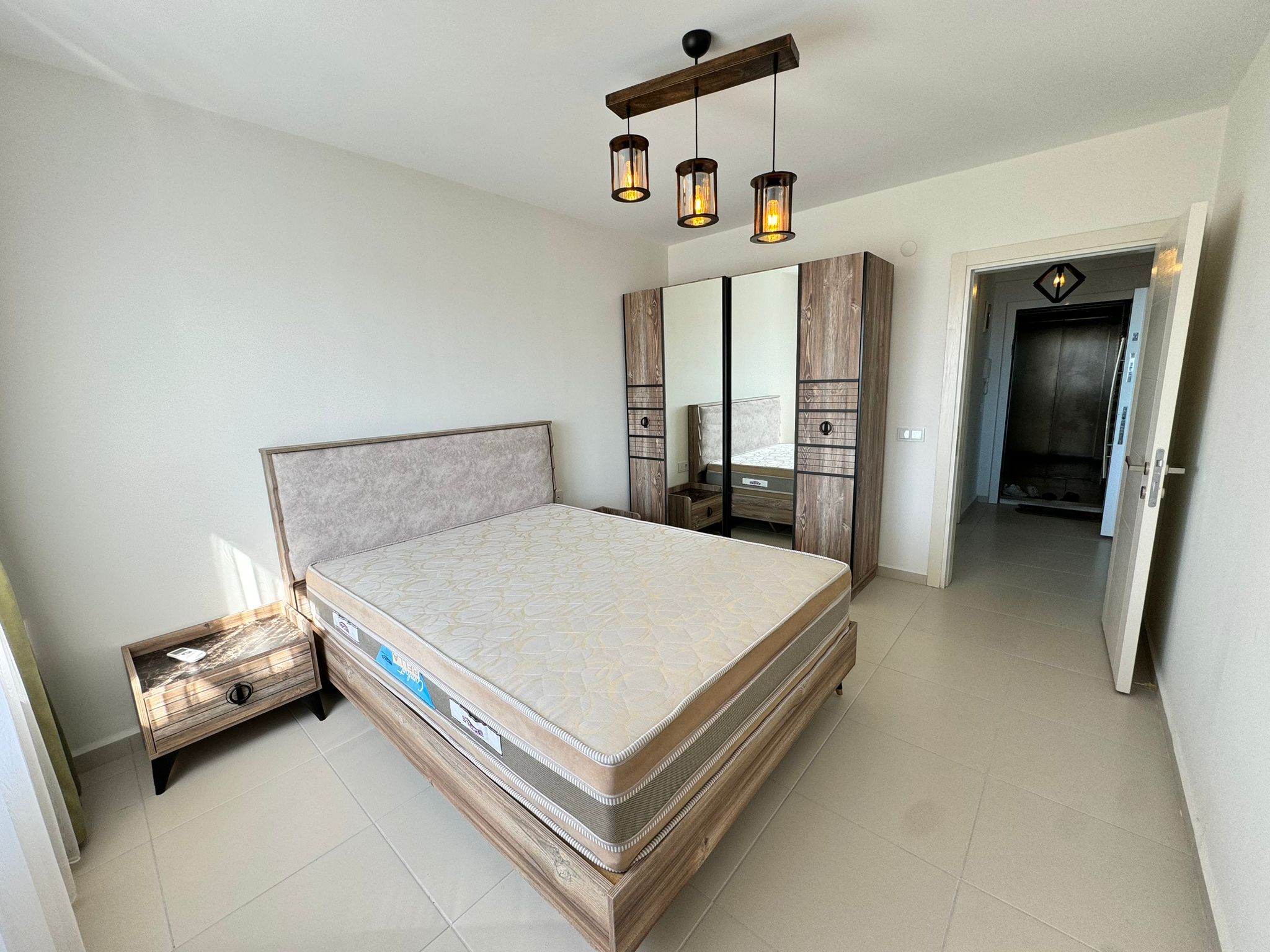 1+1 apartment in Mahmutlar – new furniture, 70 m², glazed balcony, sea and mountain views