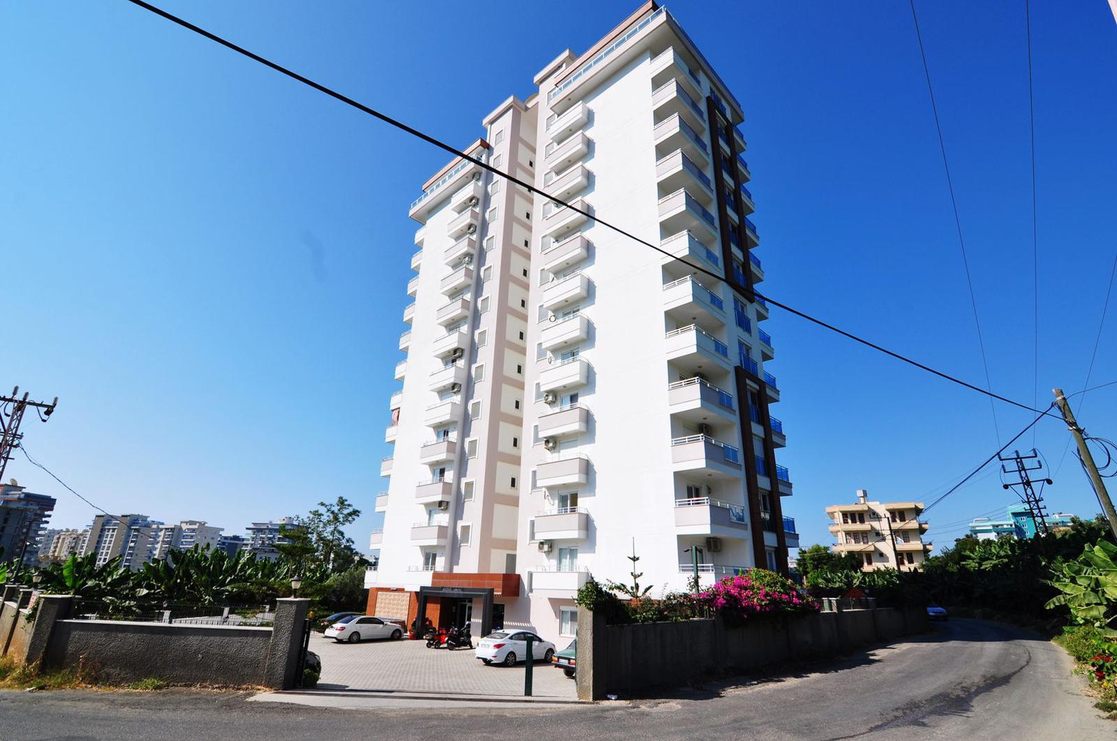 1+1 apartment in Mahmutlar – new furniture, 70 m², glazed balcony, sea and mountain views