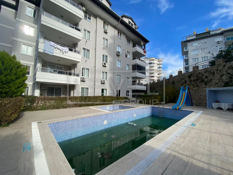 Kaydıraklı açık havuz: 2+1 daire Tosmur’da, Alanya’da, Türkiye’de satılık — New Level Group