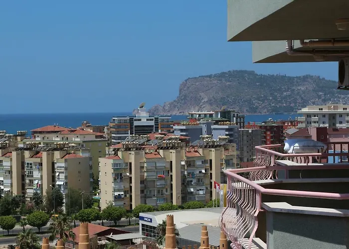 Panoramic city view with the sea and coastal mountains from a penthouse in Turkey